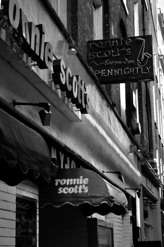 grayscale photo of store front