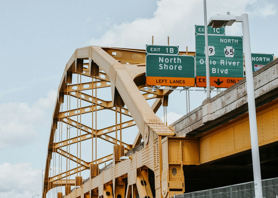 A bridge with a bunch of signs on it
